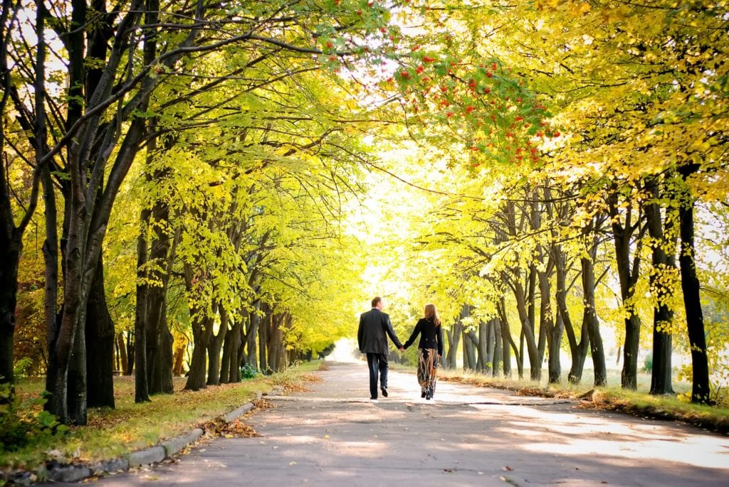 Couple walking away from a home