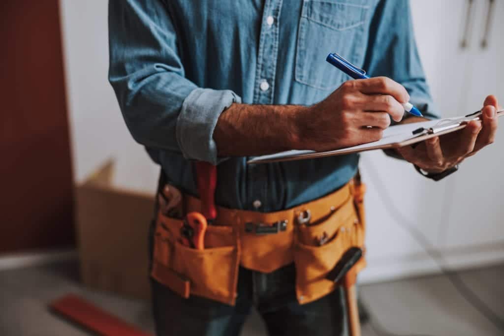 Repairman working after a home inspection . 