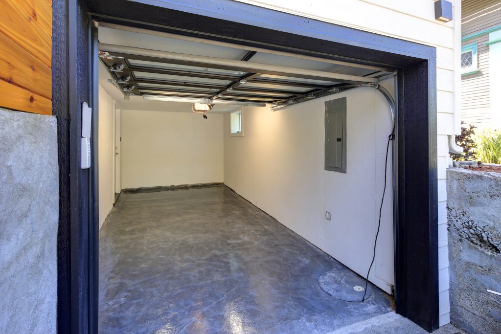 A narrow garage that fits two cars