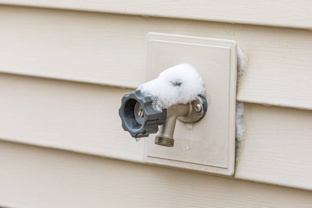 Ice-covered outdoor faucet.