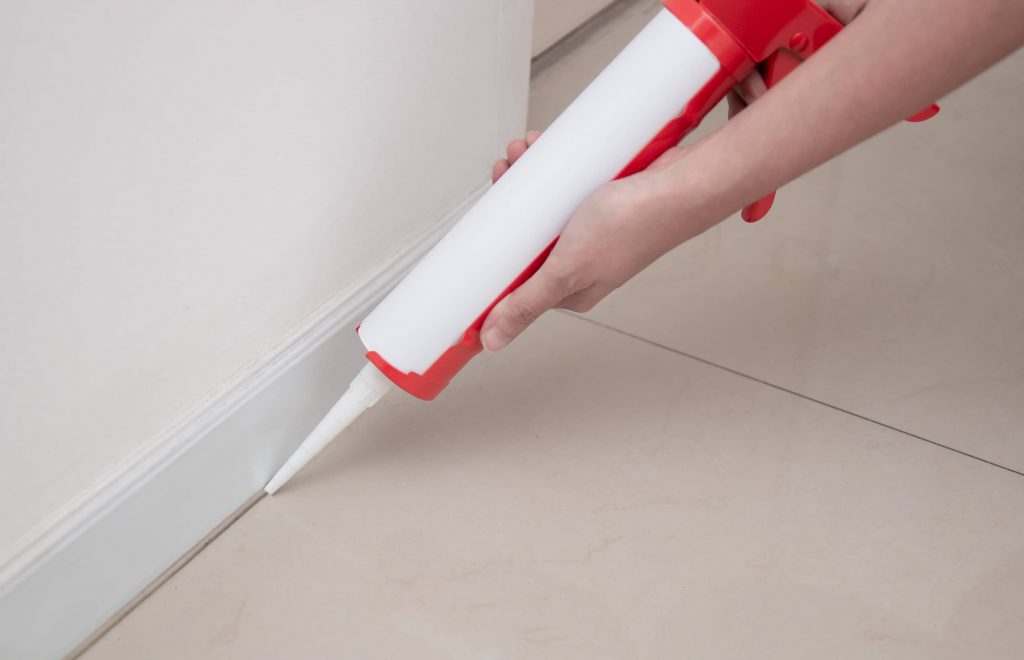 Re-caulking floor baseboards can take 30-60 min. or 24 hours depending on the type of caulk used. 