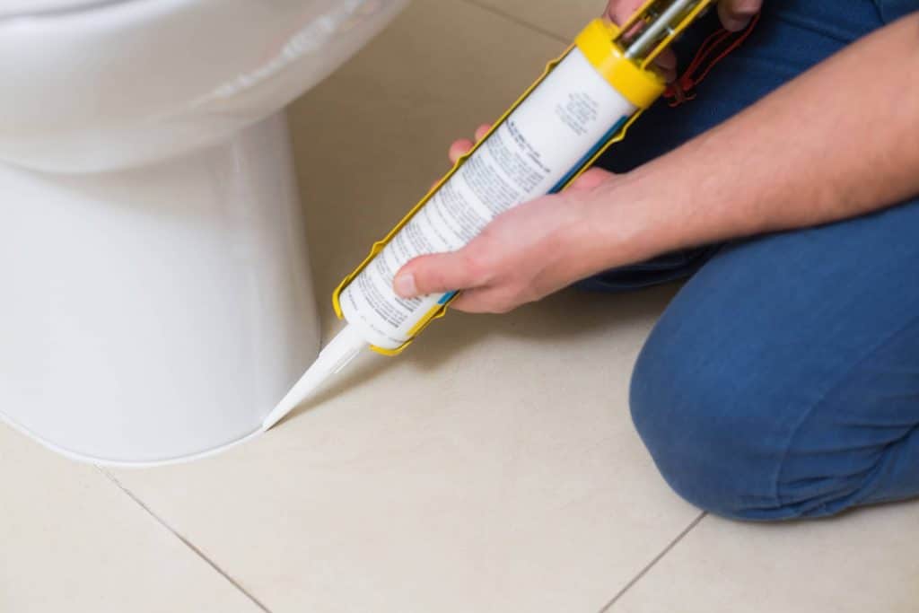 Re-caulking around the toilet bowl