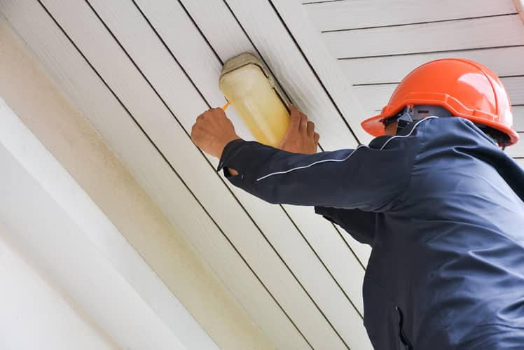 Hire a licensed electrician to remove your ceiling light covers and change the light bulbs. 