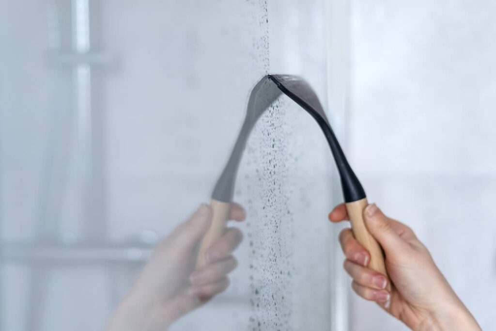 Use a squeegee to prevent the water from drying on the glass doors. 