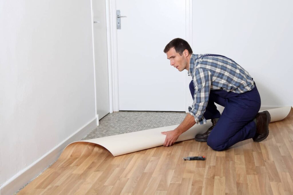 Person laying clean, new linoleum floors